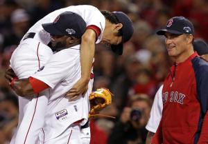 Koji Uehara gets a lift from David Ortiz after the Red Sox closer finished off Tampa Bay with just 11 pitches.  Notice the little smile on John Farrell.